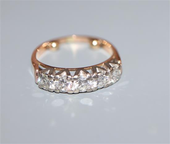 A 14k yellow metal and five stone diamond half hoop ring, size E.
